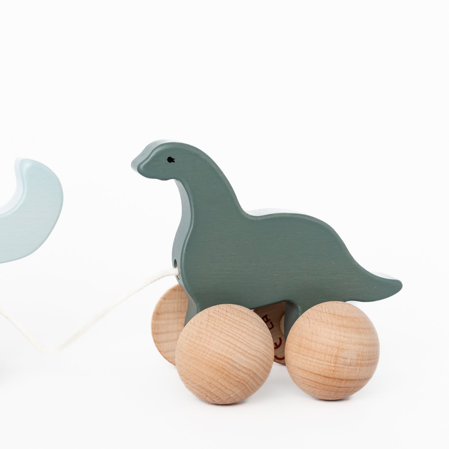 Wooden Rolling Dino Family by Konges Sløjd