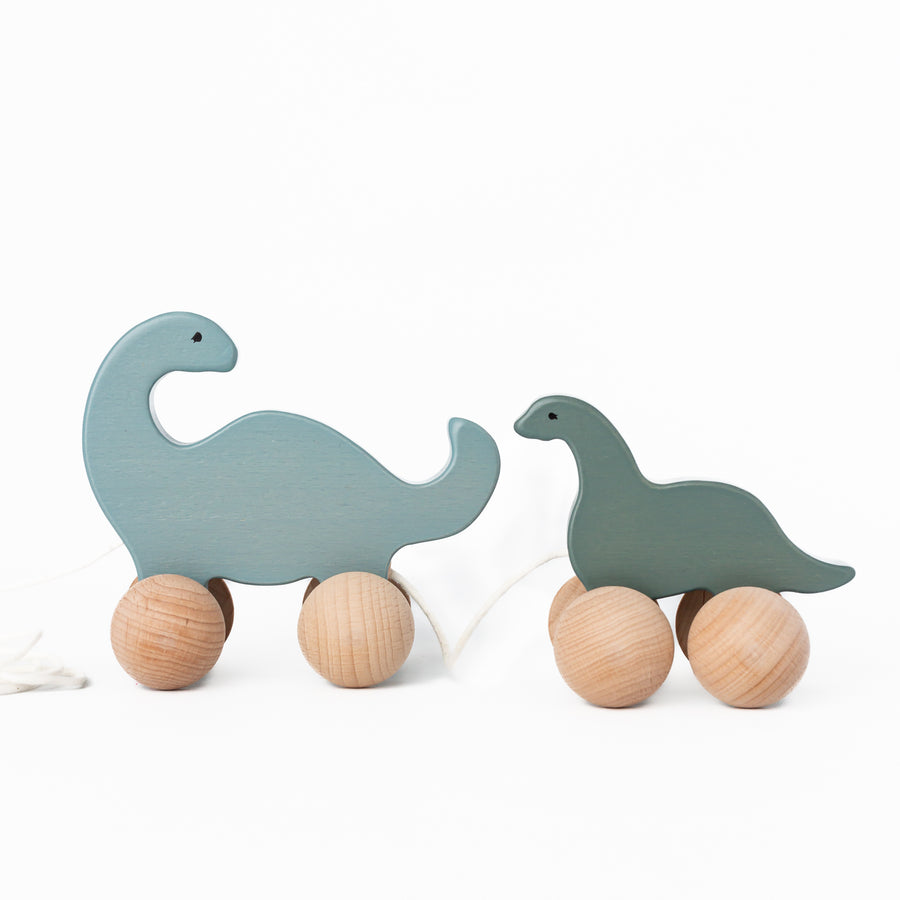Wooden Rolling Dino Family by Konges Sløjd